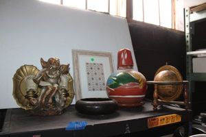 lot 180 image: Home dcor pottery vase with lid, iron angel doorstop and more