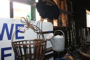 lot 191 image: Metal basket, watering can, bathroom sign, and hanging shelf