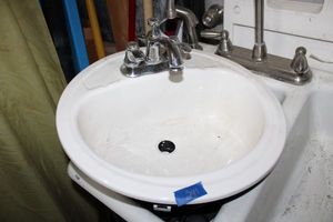 lot 241 image: Lightweight bathroom sink with faucet