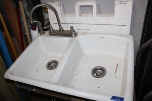lot 196 image: Plumbing HEAVY two basin Kohler kitchen sink with faucet