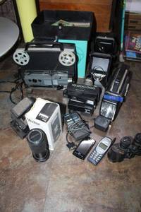 lot 258 image: Vintage Super 8 movie editor, phones, flashlight radio, Polaroid camera, Vivitar camera lens