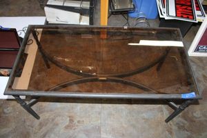 lot 282 image: Smoked glass top coffee table by Martha Living