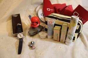 lot 329 image: Travel skin care kit, Mickey Mouse watch, and MAG coozies