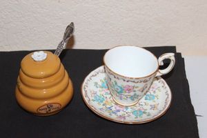 lot 31 image: Small Tea Cup and Saucer and Honey Lidded Dish with spoon