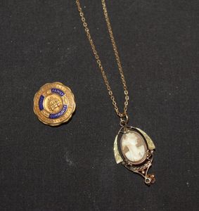 lot 150 image: Necklace With Cameo Type Pendant and VFW Pin  Both Marked 10KGF
