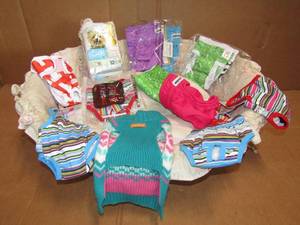 lot 21 image: Doggie diapers and accessories all are new never used, plus dog basket bed