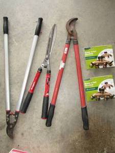 lot 24 image: Branch croppers and brush trimmers, plus two brass water hose manifolds