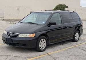 lot 139 image: 2003 Honda Odyssey EX-L mini van 3.5 Liter V6, New catalytic converter, New tires, New front brake pads, New spark plugs, Runs and drives good, Power steering pump needs replaced. Clean title