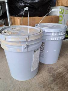 lot 147 image: Sherwin Williams latex paints, 7507 Stone Lion, 7671 On the rocks. Each approximately 12 full.