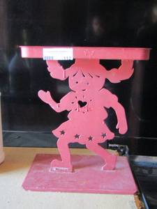 lot 112 image: little girl counter top stand or plant holder, made out of metal pretty neat piece