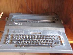 lot 116 image: Panasonic type writer RK-T30  with book
