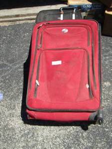 lot 146 image: red and black luggage