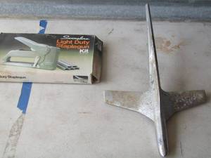 lot 214 image: 1955 FORD FAIRLANE CHROME AIRPLANE HOOD ORNAMENT  & Heavy duty stapler nib