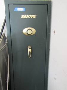 lot 9 image: Sentry GUN SAFE  green in color,  combination included when purchased