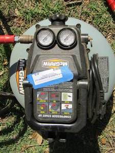 lot 63 image: McGraw Air Compressor with hose