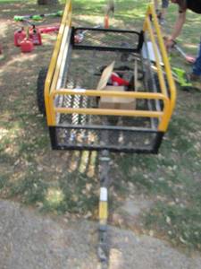 lot 4 image: Large yellow and black garden cart on wheels, folds down for easy storage, pull behind