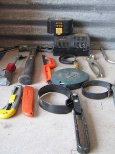 lot 120 image: TOOL LOT -   MICROMETER, HAMMER, OIL FILTER WRENCH, RYOBI 14.4 BATTERY W CHARGER, KNIVES,  TAPE MEASURE PLUS