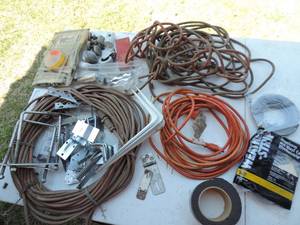lot 21 image: Extension cords ,weather strip,and some brackets and more see pictures