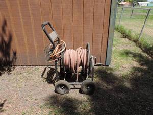lot 75 image: Water hose cart and water hose