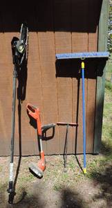 lot 85 image: Electric pole saw water shut off and push broom and weed eater
