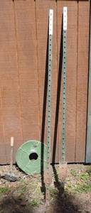 lot 87 image: Come along, water hose, and 2 fence poles