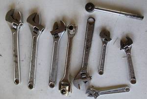 lot 15 image: Lot of adjustable wrenches some are craftsman and dog bone wrenches