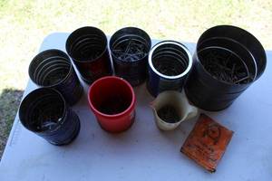 lot 58 image: Cans with nails screws Staples see pictures