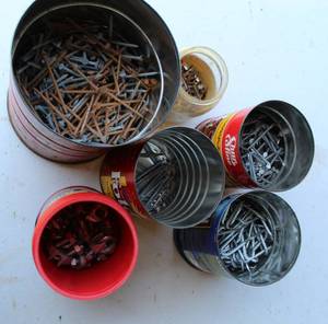 lot 61 image: Cans with nails  Staples see pictures