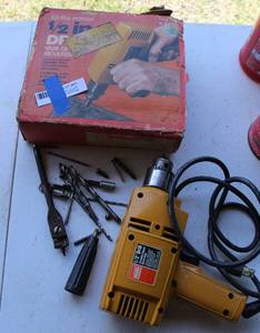 lot 63 image: Montgomery ward12 drill and a few bits as seen in picture