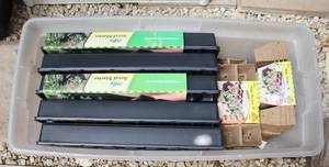 lot 82 image: tote full of seed starter trays and seed starter pots