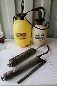 lot 161 image: Sprayers one missing the top and 2 grease guns