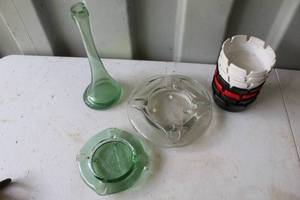 lot 165 image: Masonic ashtray or Free mason , the clear glass one has the state of Texas on it couldnt get it to show up in pictures, and a green bottle and a stack of plastic ash trays