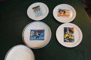 lot 209 image: lot of movie plates in a tin holder see pictures