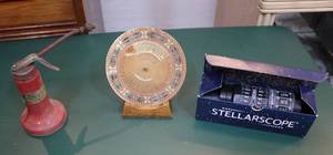 lot 224 image: 100-year perpetual calendar and vintage stellarscope handheld star finder with box and thumb pump oil can
