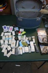 lot 248 image: overnight bag with a lot of motel shampoo and conditioners and more see pic