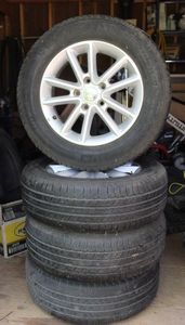 lot 121 image: Four Dodge Rims and Tires P22565R17