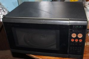lot 123 image: Sharp Household Microwave Model #R3H85 Works, Needs Cleaned