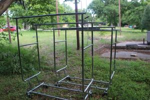 lot 129 image: Two Folding, Rolling Clothing Racks
