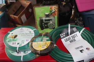 lot 139 image: Four Water hoses, 3 - 25ft soaker 1- 50ft and Watering Timer