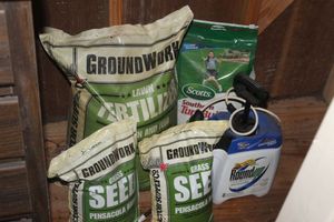 lot 146 image: Ground Works Lawn Fertilizer, Groundworks Grass Seeds, Roundup and Scotts Turf Builder