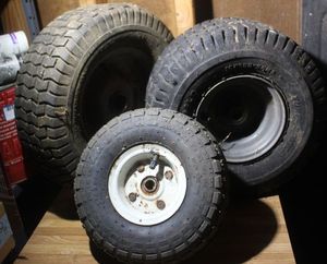 lot 309 image: Three Lawnmower Tires of Different Sizes