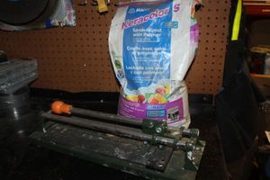 lot 277 image: Sanded Grout and tool