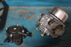 lot 416 image: Small Engine Carburetor and Fuel Pump, Appears Unused