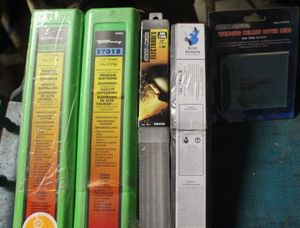 lot 427 image: Unopened Welding Rods and Welding Helmet Lens as Shown