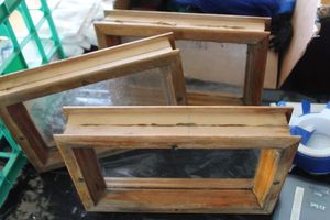 lot 384 image: Three Wood and Glass Window Blocks