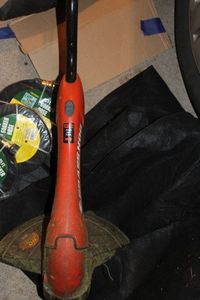 lot 386 image: GrassHog Electric Weedeater Soaker Hoses, Flower bed Liners and More