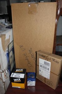 lot 41 image: Dodge Parts Including,  Coil Packs, V8 Gasket, Wix Oil Filter and Mopar TPS