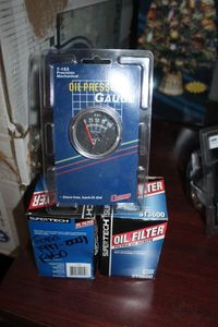 lot 50 image: Supertech Oil Fiters for Ford F150 1997-2009 and Oil pressure Gauge