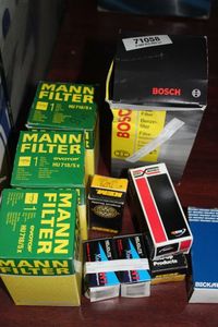 lot 56 image: Mercedes and Subaru Parts, 3 Mann Oil Filters,Part # HU7155x,BeckRnley  Part # 201-1220, Borg Warner, Part R14157 Relay,2 KEM TW79 Temp Sender, 2 Heliolite Replacement Bulbs H7, and Boxch Fuel Filter 71058