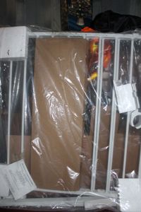lot 118 image: BabyPet Gate Never Installed, all parts are there Box was messed up
